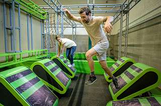 Two people complete the Indoor Ninja Course at Sunstar Arosa